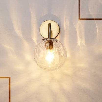 Contemporary Textured Globe Wall Light with Brass Arm | Single-Bulb Sconce for Bedroom, Hallway & Living Room | Hardwired Electric Fixture