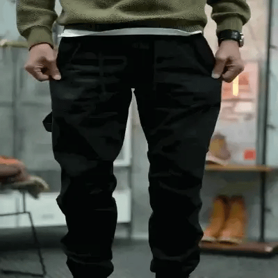 Pantalones cargo, bolsillos múltiples, puños con cremallera