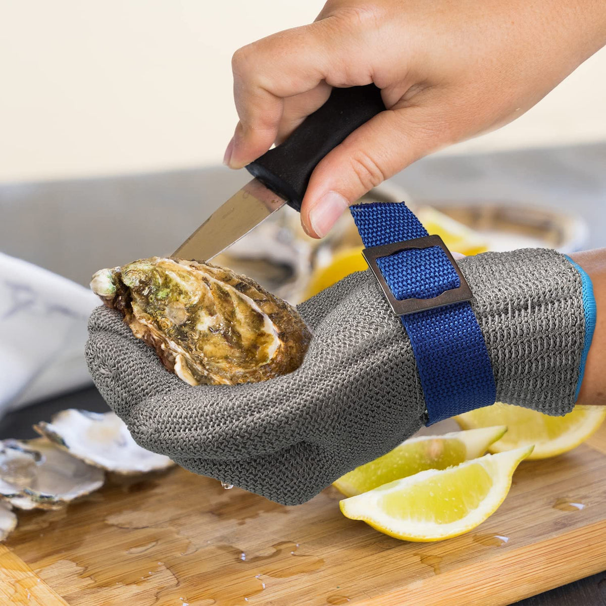 Guante de malla de acero inoxidable resistente a cortes y apto para uso alimentario