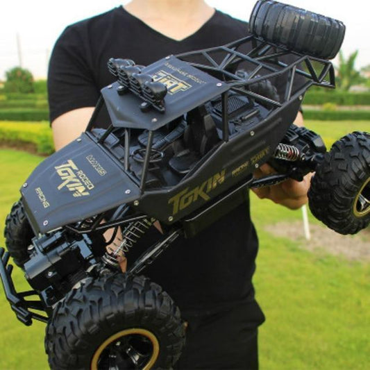 1:12 Scale Hobby-Grade Climbing Truck with 2.4GHz Radio & Shock-Absorbing Suspension for Dirt, Rocks, Grass