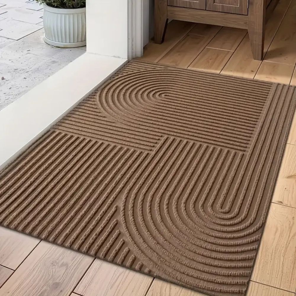 Felpudo Creston: microfibra, diseño de hilo curvado, uso interior y exterior