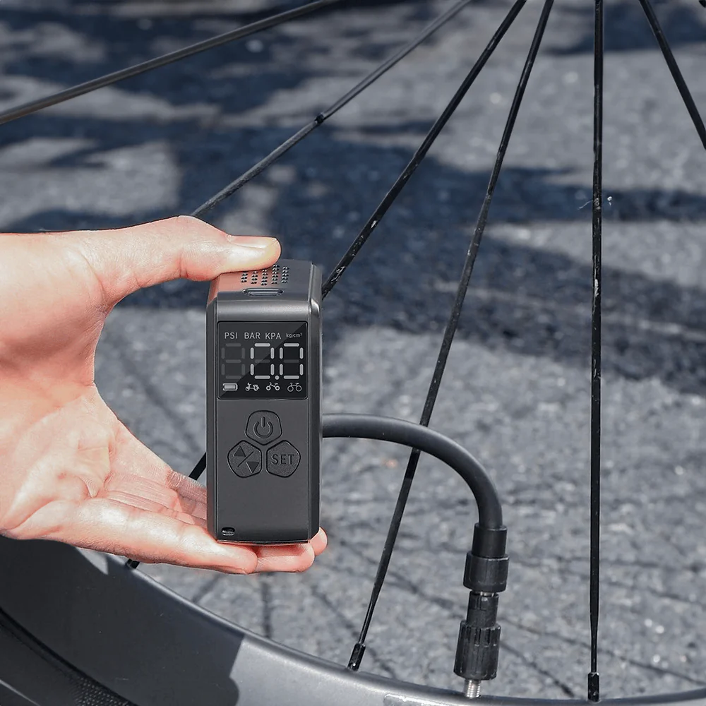 Compresor de aire portátil compacto con pantalla LCD y carga USB