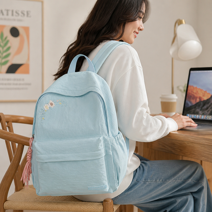 Mochila escolar con bordado floral y múltiples bolsillos