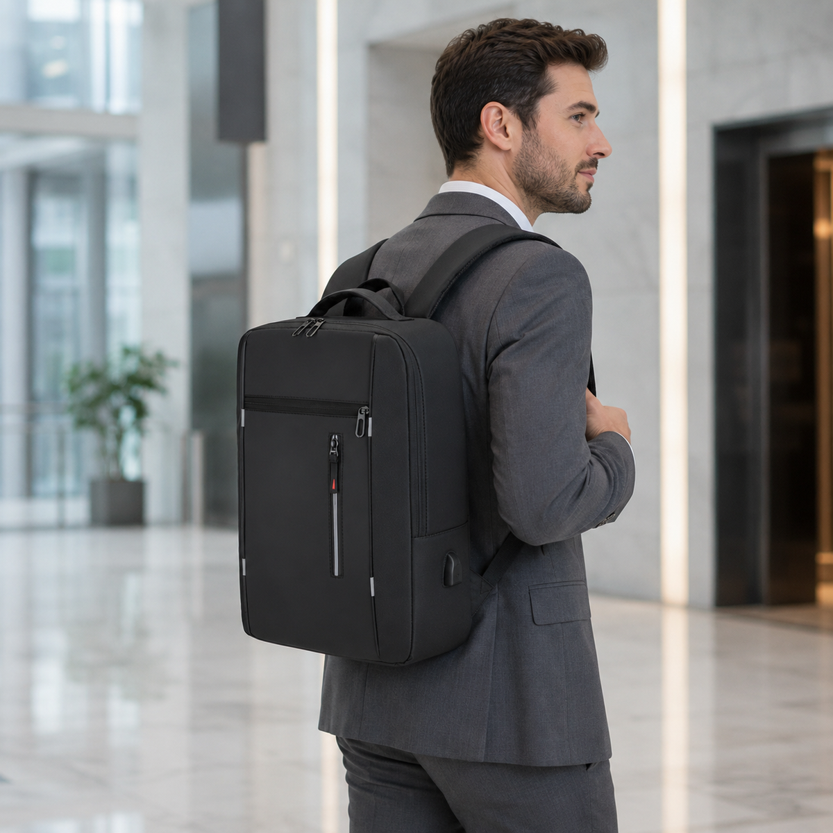 Mochila impermeable para portátil con puerto de carga USB – Compartimento acolchado para notebook de 15.6 pulgadas – Mochila urbana para trabajo, escuela y viajes