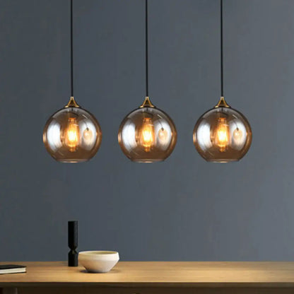 Three-Light Hanging Ceiling Fixture with Tapered Glass Globes in Antique Brass Finish for Dining Room Kitchen Island