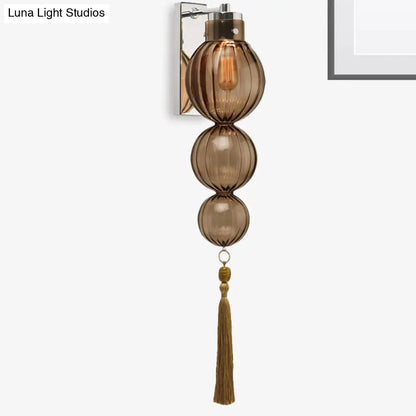 Round Glass Wall Sconce with Decorative Tassel | Asian-Inspired Globe Fixture | Chrome or Brass Finish for Living Room, Hallway, Bedroom