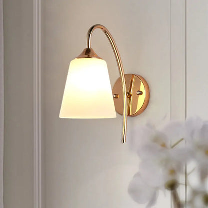 Curved Arm Wall Sconce with Tapered Glass Shade – Adjustable Brass Finish Fixture for Bedroom & Hallway