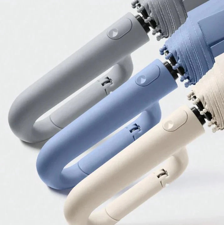Paraguas compacto con borde de seguridad y mango ergonómico