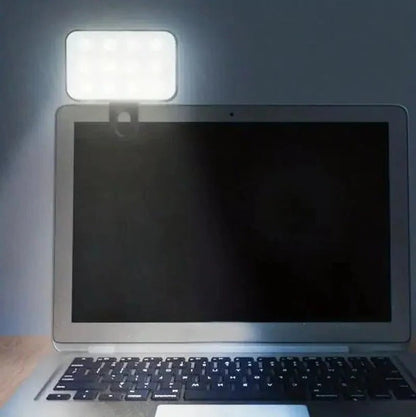 Linterna LED recargable con clip para teléfono